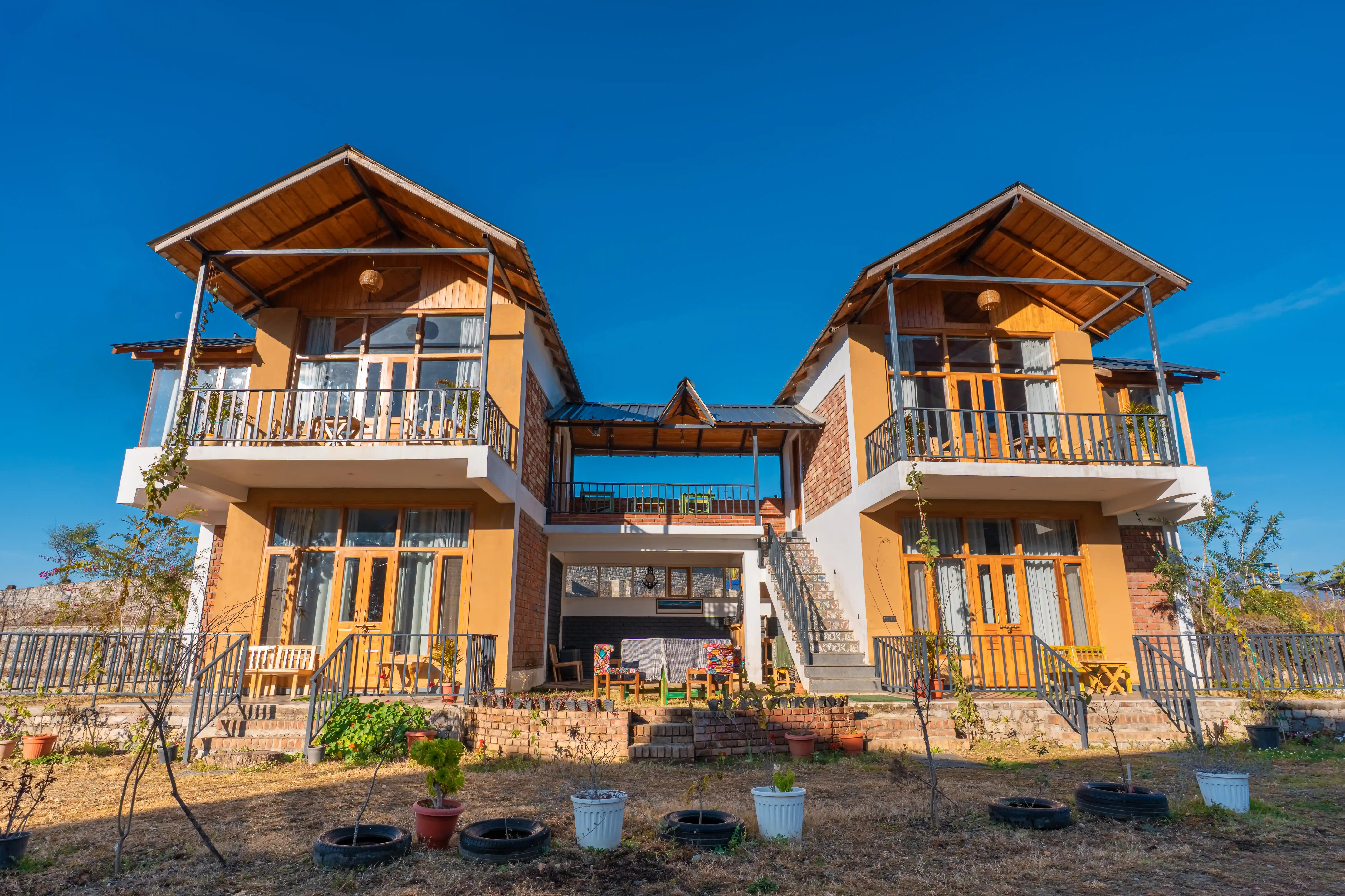 Full cottage buyout view with surrounding pine trees
