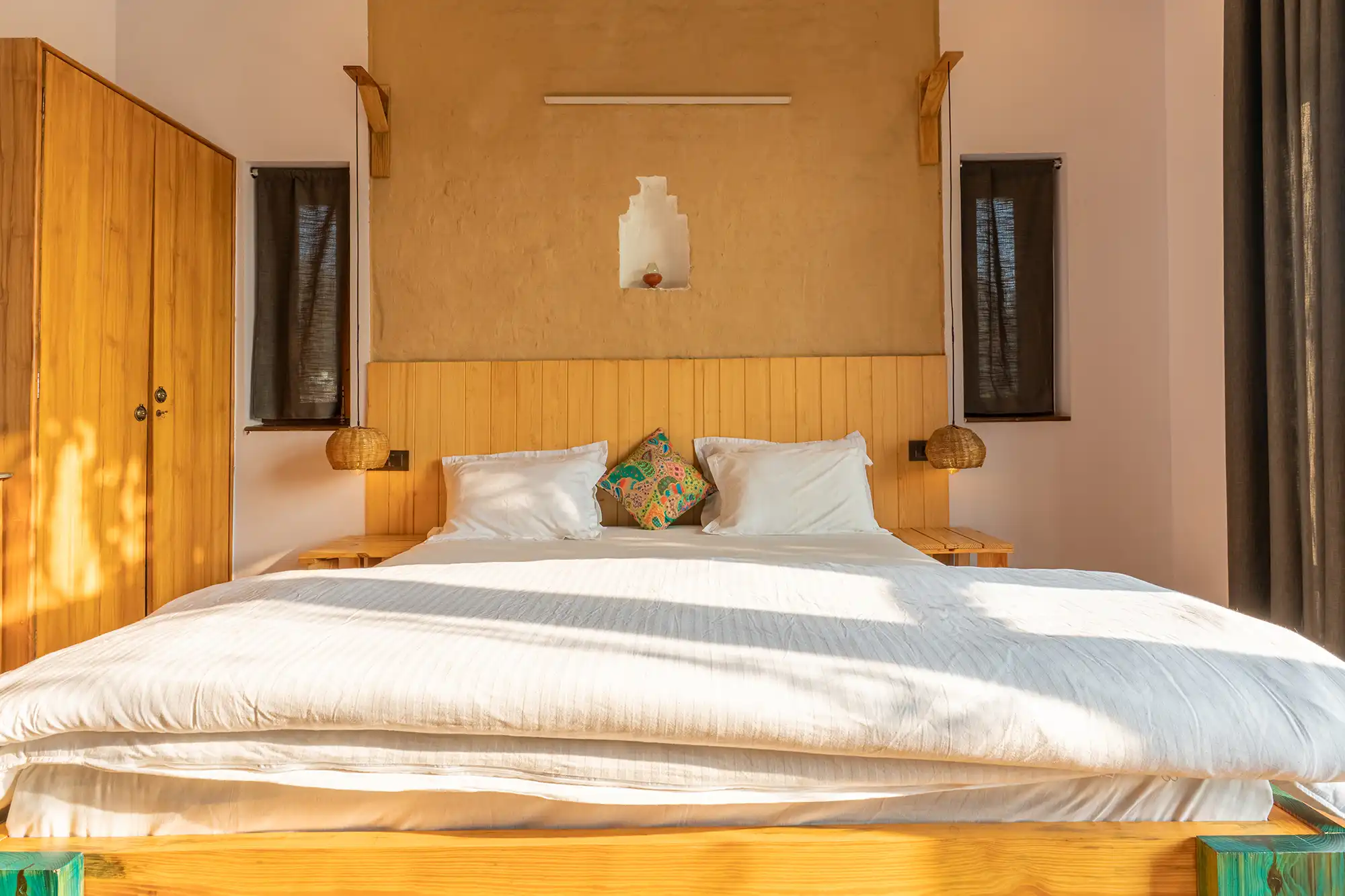 "Luxury King Size Bed with premium linens in a wooden attic room at Ethnic Trail Dharchula House, a heritage homestay near GD Goenka International School Bhimtal."