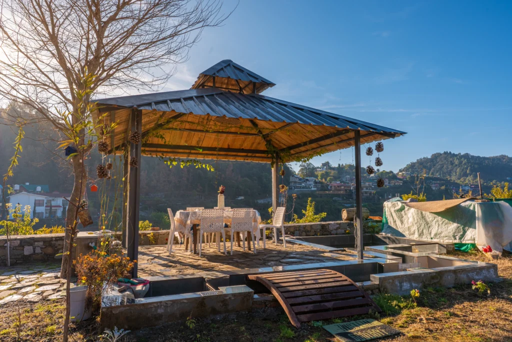 Cozy wooden attic bedroom at Ethnic Trail, a heritage homestay offering premium cottages with room and kitchen in Bhimtal and Naukuchiatal.